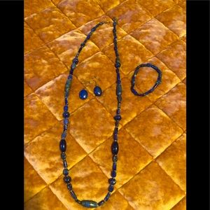 Genuine blue lapis matching necklace, bracelet, and earrings set.